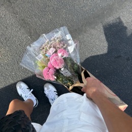 a couple holding flowers